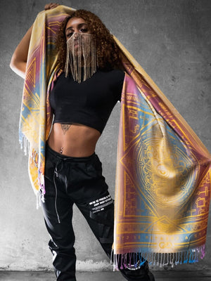 Woman in black holding yellow dharma shawl