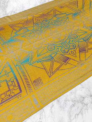 Yellow Dharma shawl with geometric design on marble