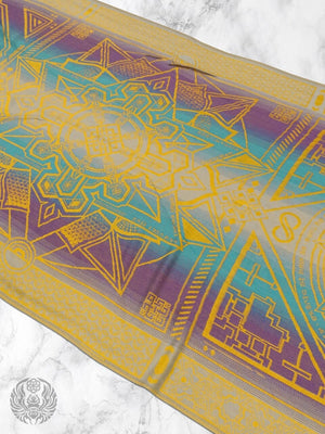 Yellow dharma shawl with geometric design on marble