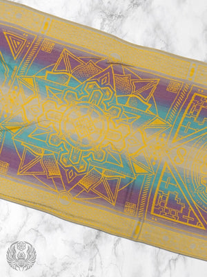 Yellow Dharma shawl with geometric pattern on marble
