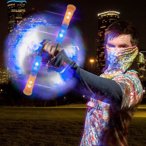 Poi performer with Helix Poi Pro, night scene
