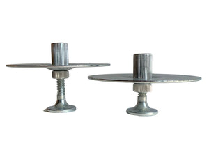 Two metal candlestick holders.
