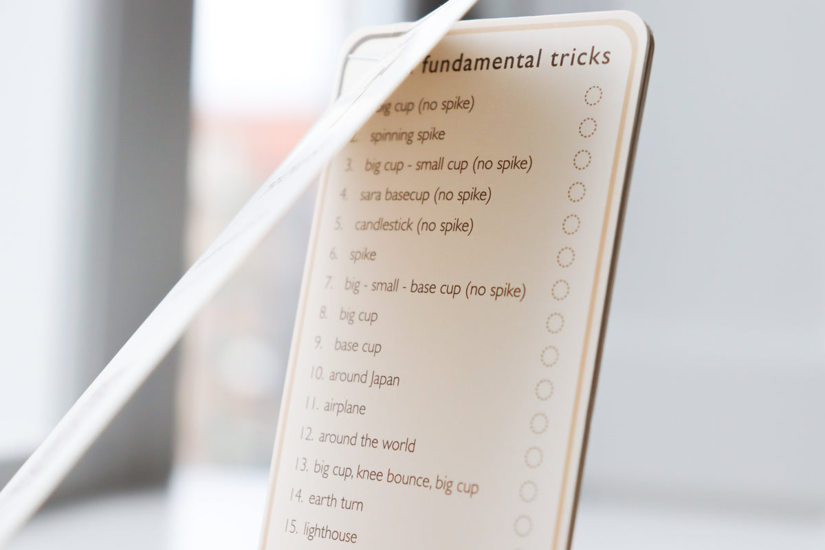 Purple Bloom Kendama with Tricklist