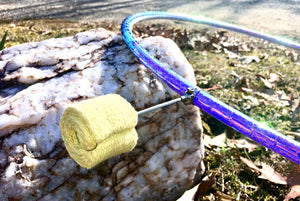 Fire spinning prop on a rock